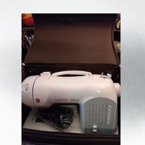 2009 singer Athena sewing machine new with rolling bag